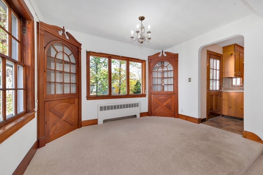 8 Tower Road Lexington, MA 02421 - Photo 10 of 39 a view of an empty room with a window