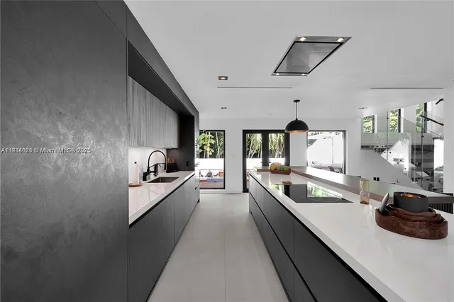 a kitchen with a table chairs and refrigerator