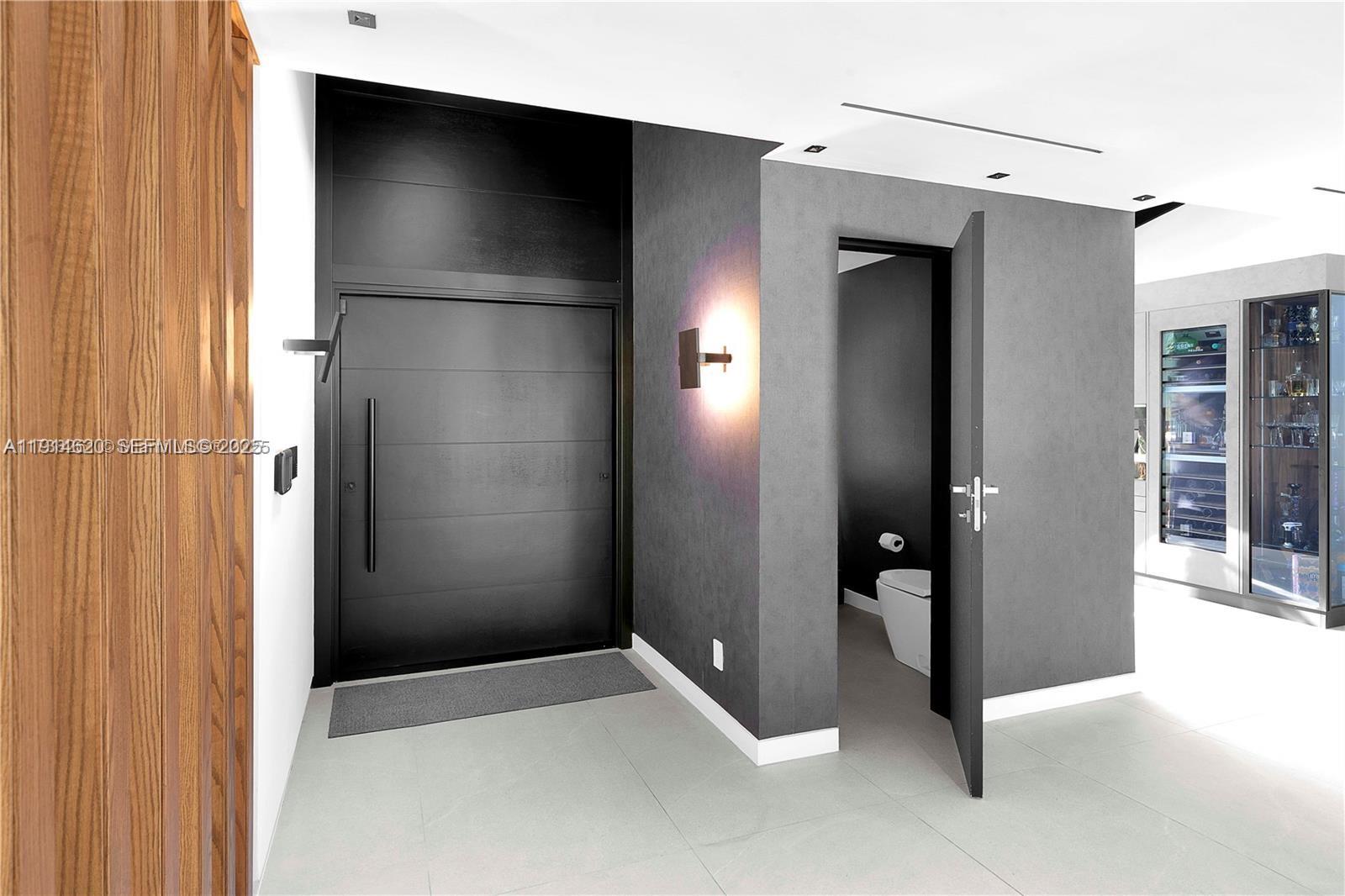 3760 Douglas Road Miami, FL 33133 - Photo 19 of 70 a view of an empty room with wooden floor