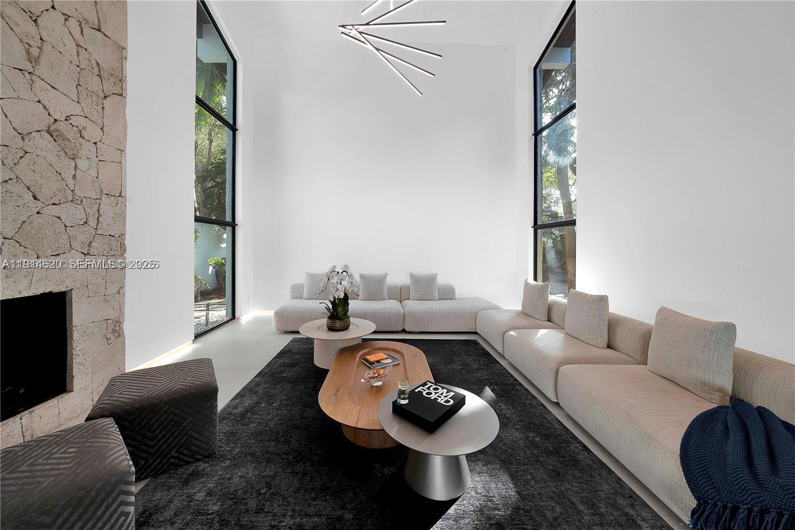 3760 Douglas Road Miami, FL 33133 - Photo 29 of 70 a living room with furniture and a fireplace