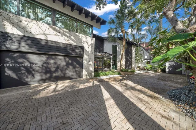 a view of a pathway of a house with a porch