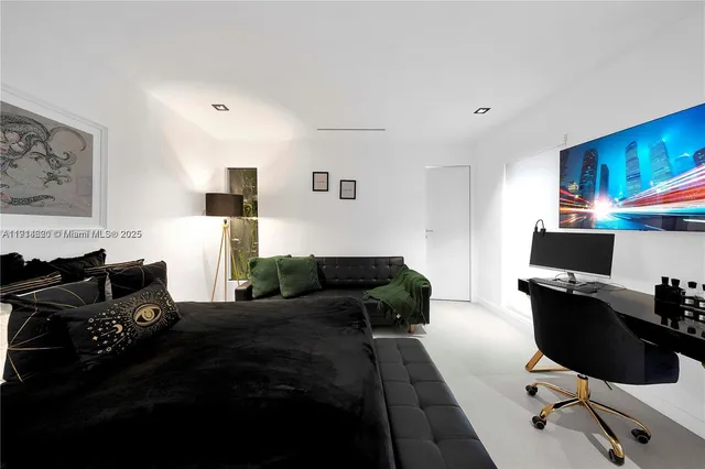 a spacious bedroom with a bed and a window