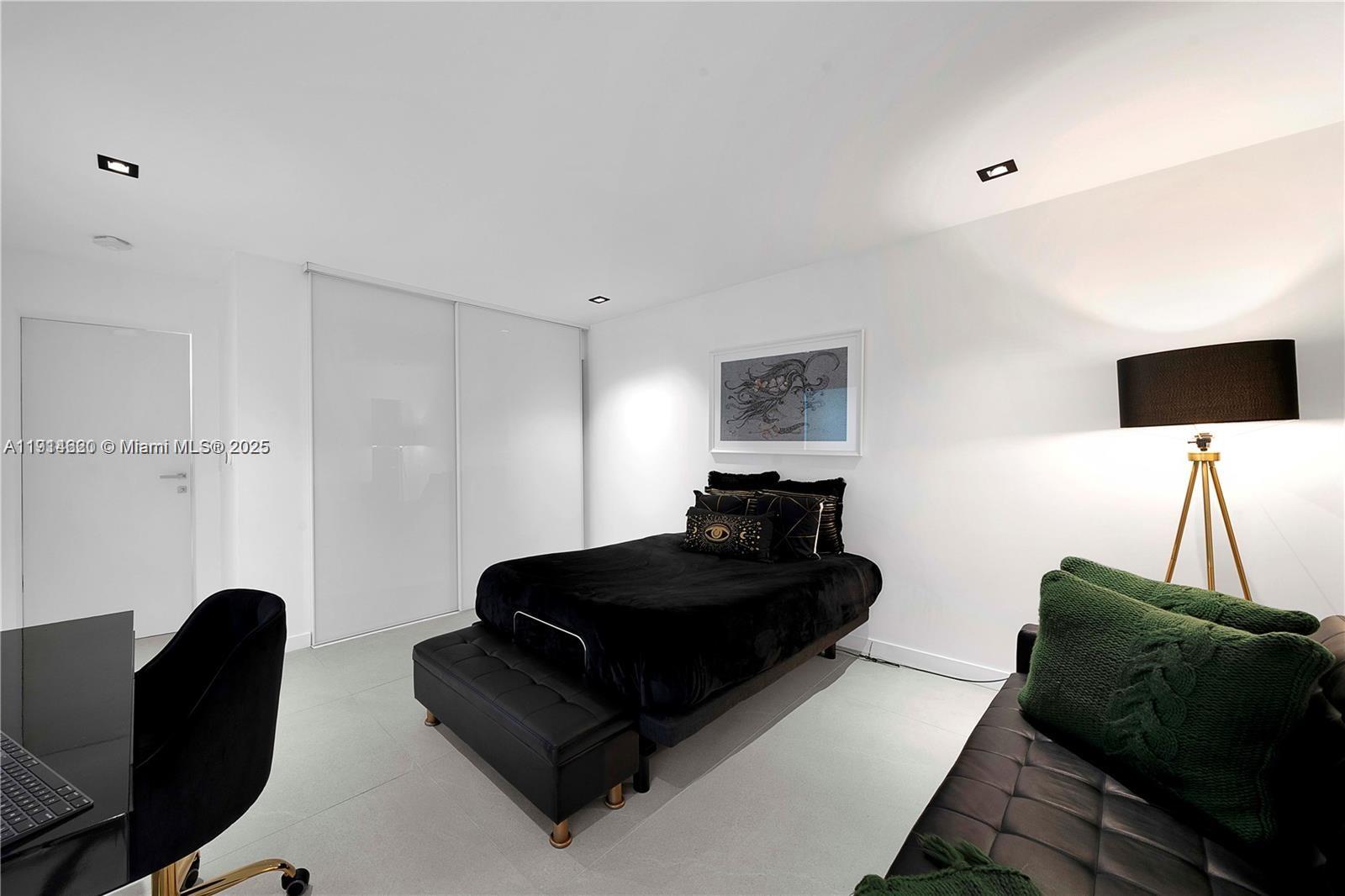 3760 Douglas Road Miami, FL 33133 - Photo 38 of 70 a living room with furniture and a flat screen tv