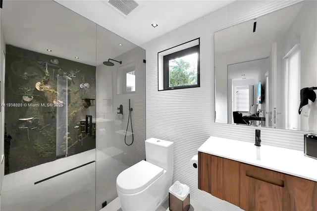 a bathroom with a sink vanity and a mirror