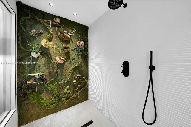 a bathroom with a tub sink and a mirror