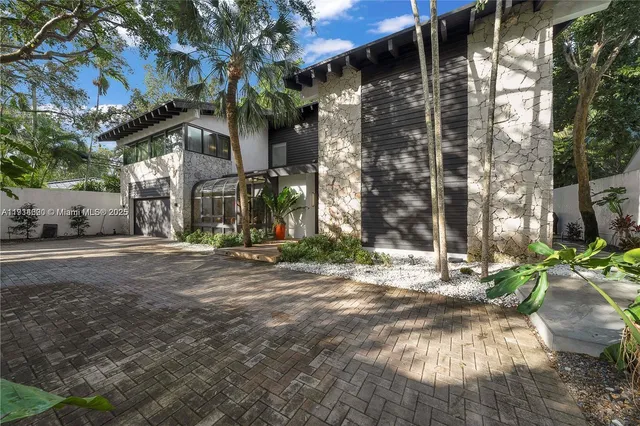 a kitchen with granite countertop a stove and cabinets