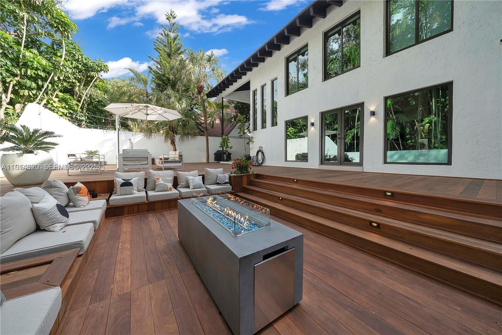 3760 Douglas Road Miami, FL 33133 - Photo 67 of 70 a living room with patio furniture and a potted plant
