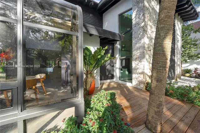 a large kitchen with a large counter top appliances and cabinets