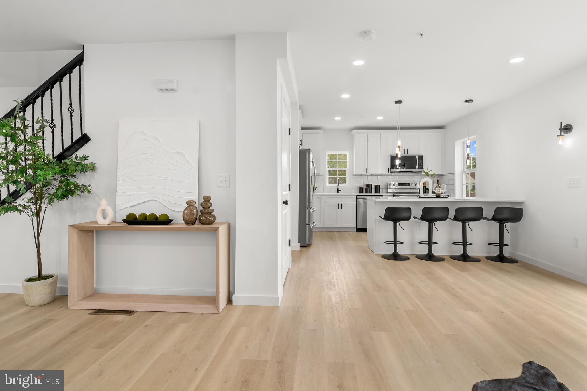 7817 Liberty Road Windsor Mill, MD 21244 - Photo 21 of 50 a living room with furniture and a potted plant