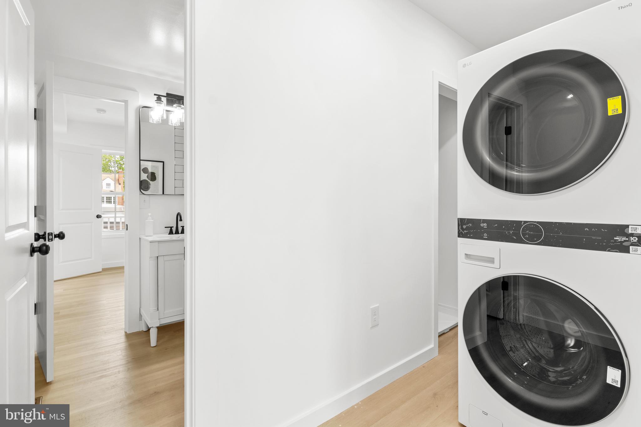 7817 Liberty Road Windsor Mill, MD 21244 - Photo 22 of 50 a view of a hallway with washer and dryer