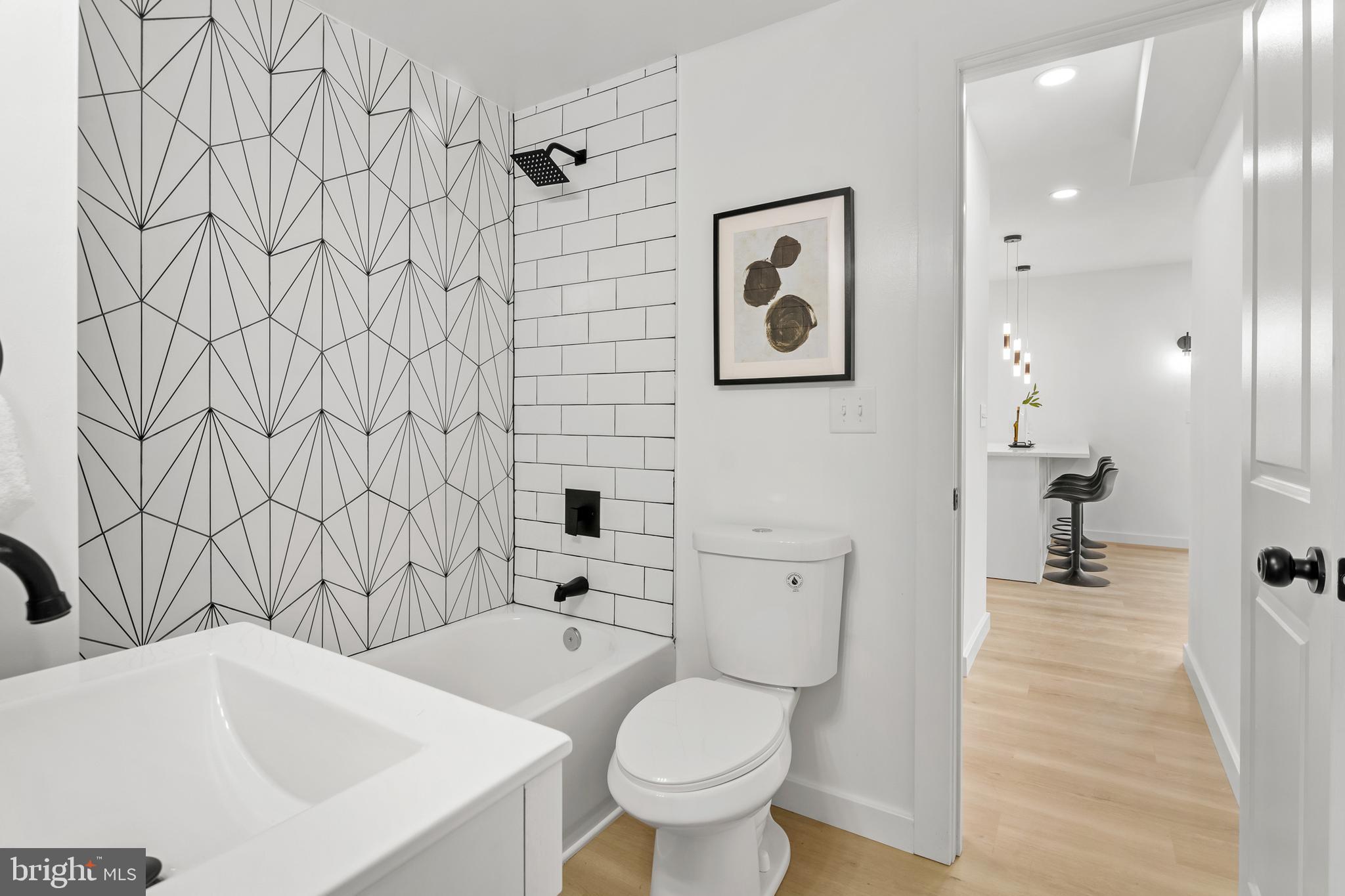 7817 Liberty Road Windsor Mill, MD 21244 - Photo 25 of 50 a bathroom with a sink toilet and shower