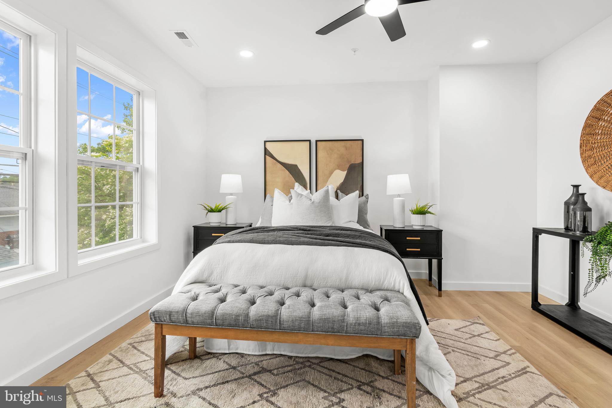 7817 Liberty Road Windsor Mill, MD 21244 - Photo 26 of 50 a bedroom with a bed a window and potted plant on the dresser