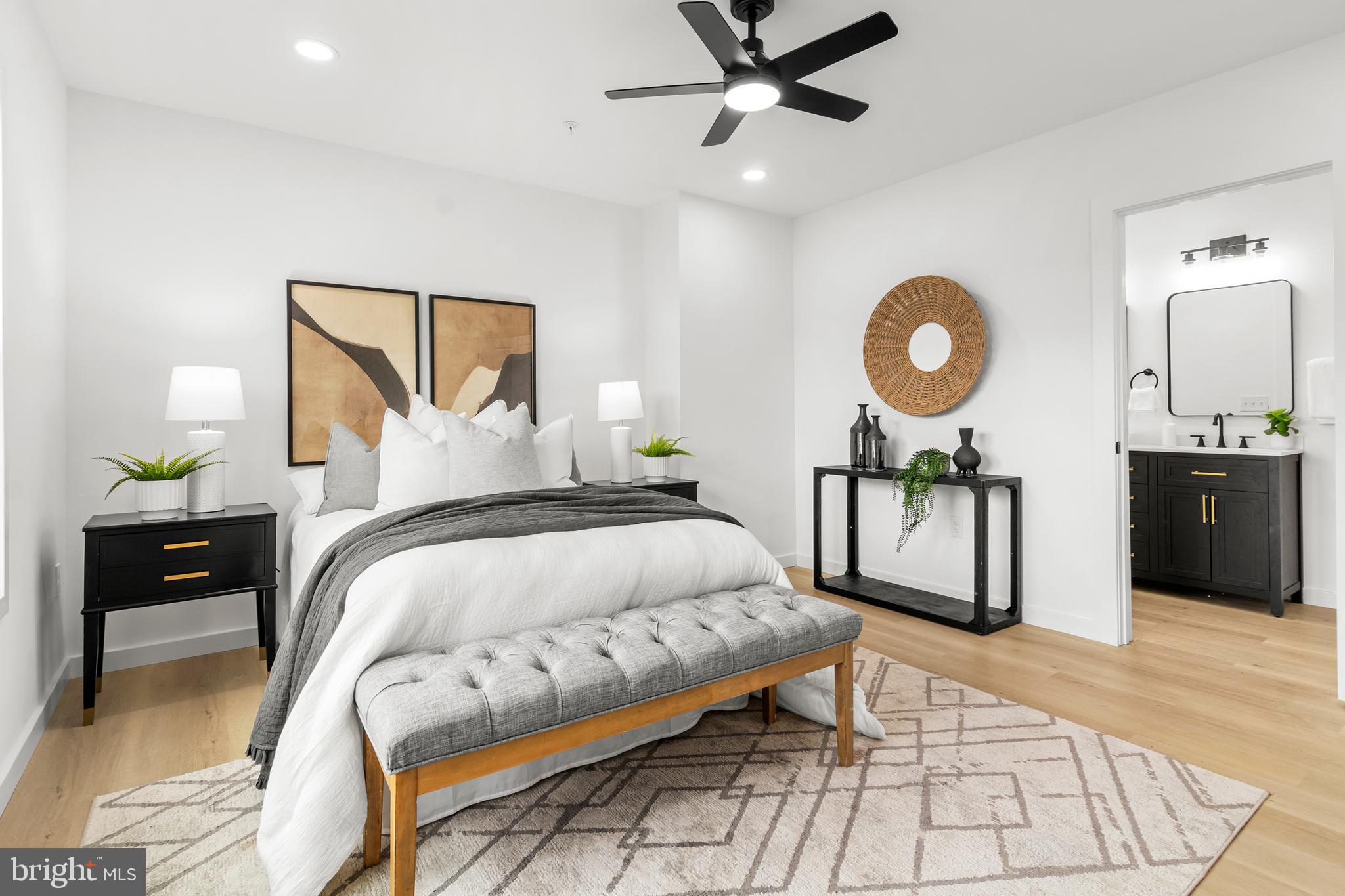 7817 Liberty Road Windsor Mill, MD 21244 - Photo 27 of 50 a bedroom with a bed mirror and a table