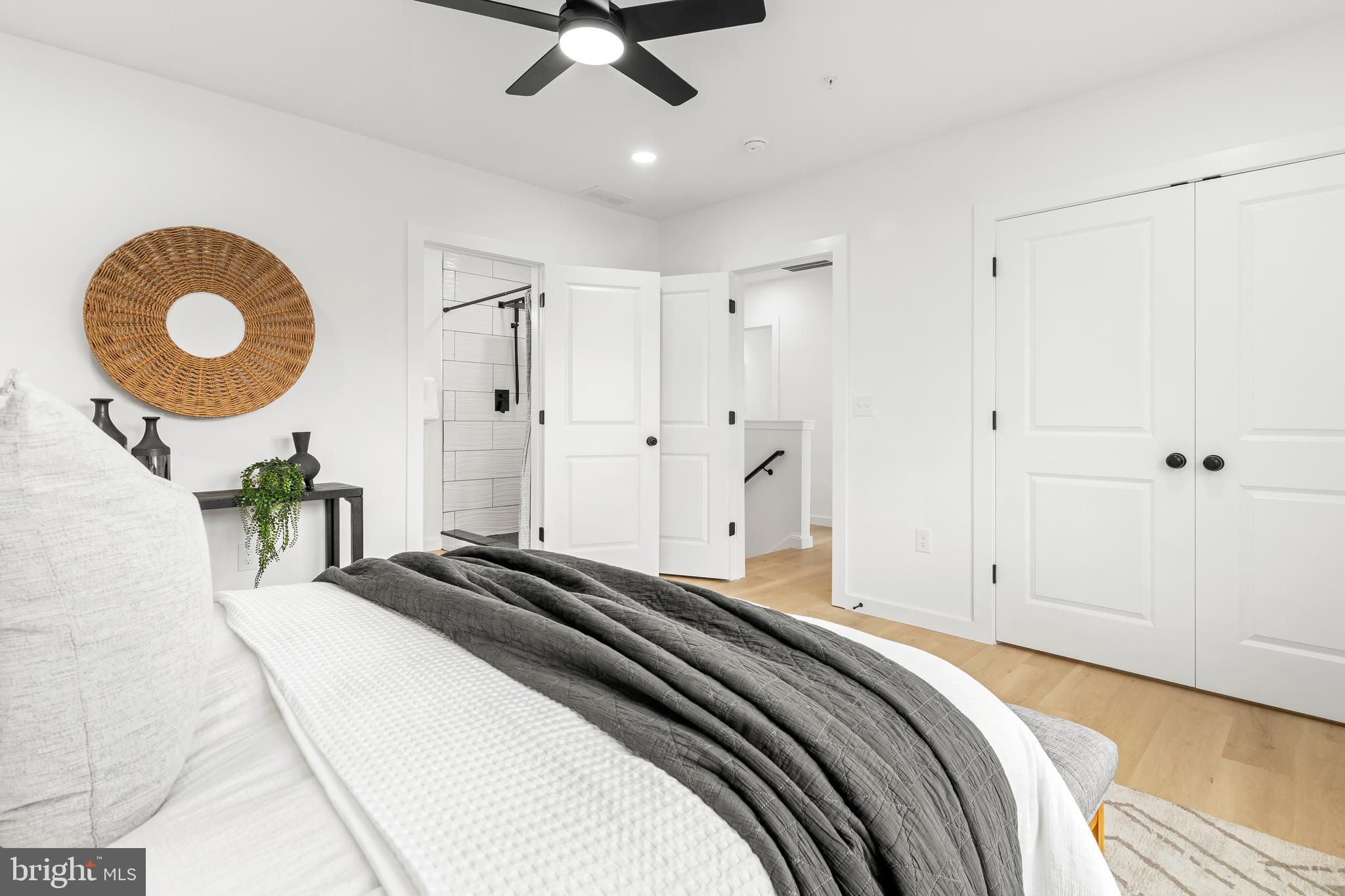 7817 Liberty Road Windsor Mill, MD 21244 - Photo 28 of 50 a bedroom with a bed and a chandelier