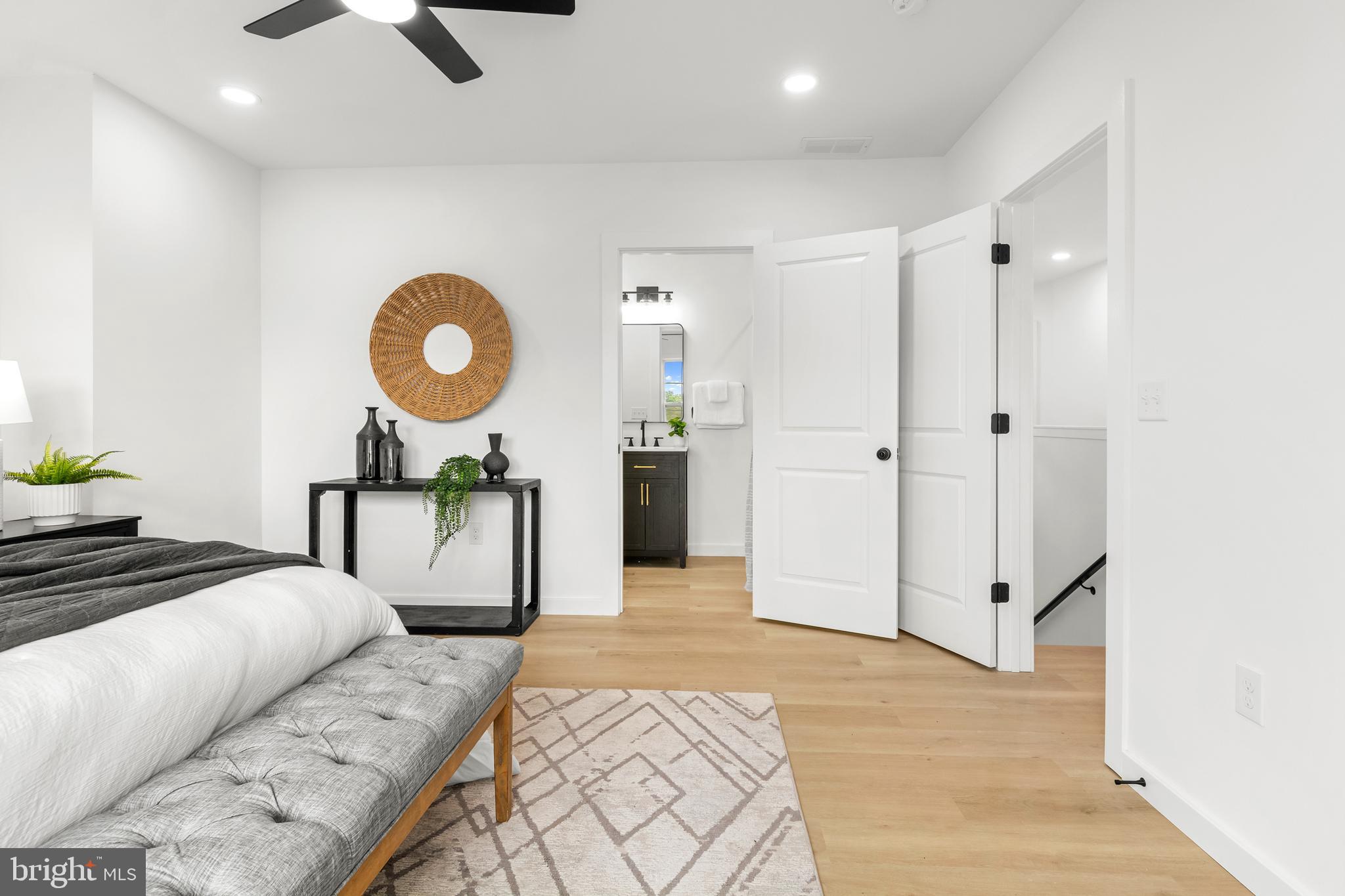 7817 Liberty Road Windsor Mill, MD 21244 - Photo 29 of 50 a bedroom with a bed and a chandelier