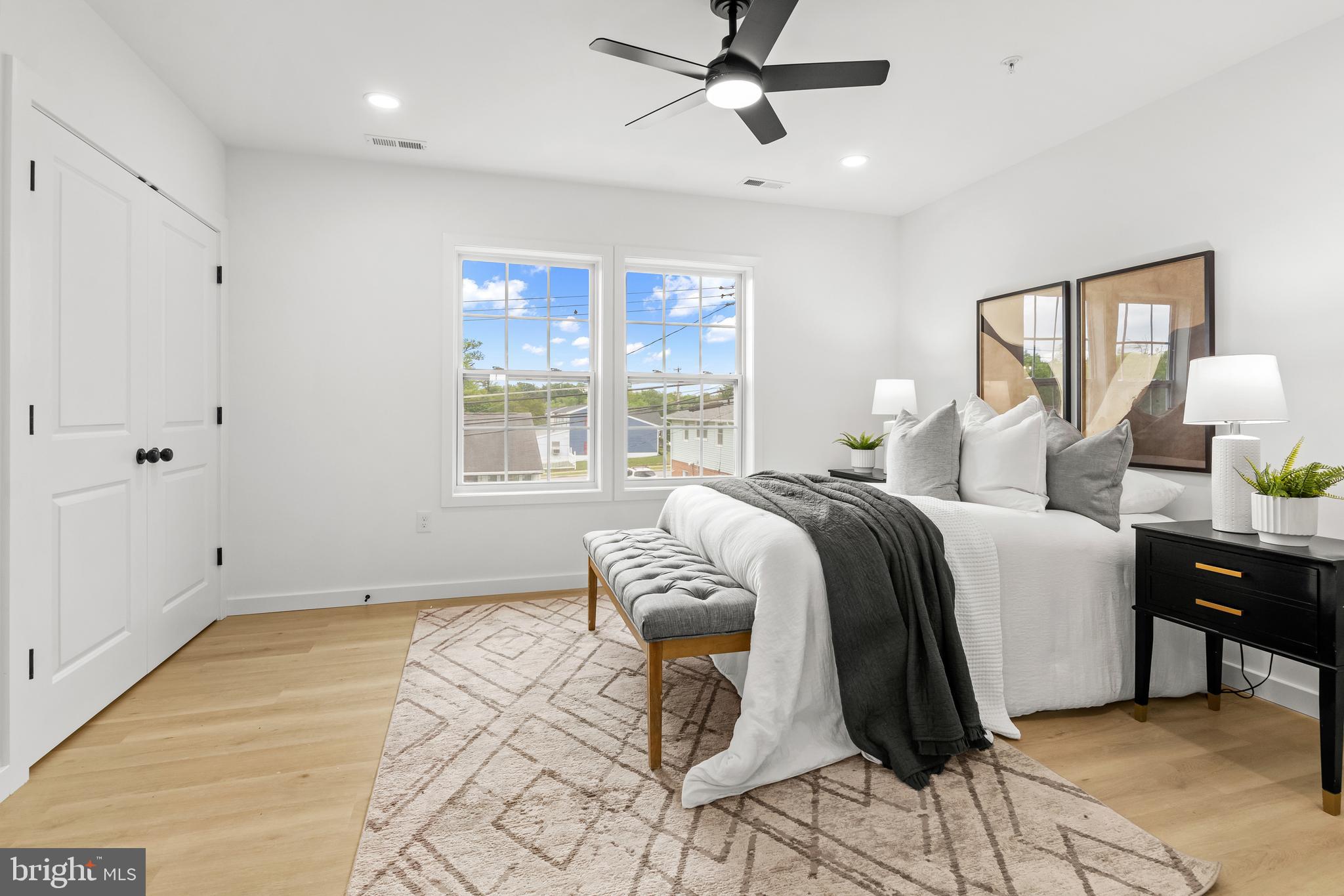 7817 Liberty Road Windsor Mill, MD 21244 - Photo 31 of 50 a bedroom with a bed and wooden floor