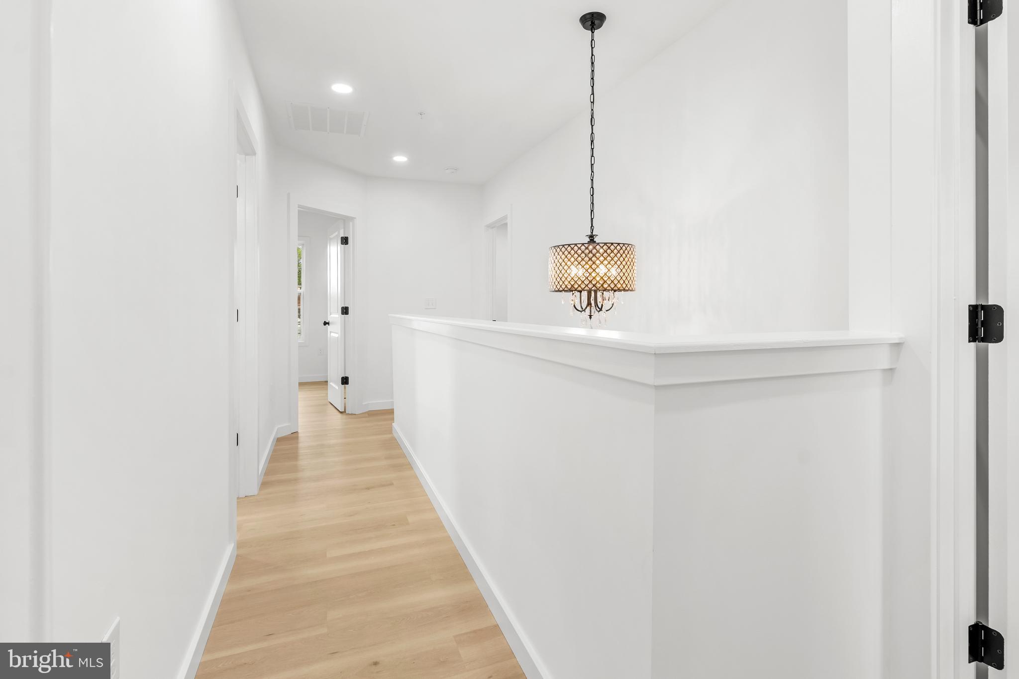 7817 Liberty Road Windsor Mill, MD 21244 - Photo 42 of 50 a view of hallway with wooden floor