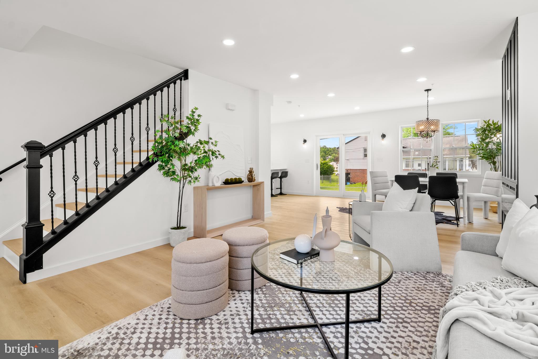 7817 Liberty Road Windsor Mill, MD 21244 - Photo 8 of 50 a living room with furniture and a chandelier