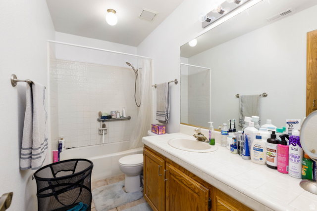 3707 Gates Circle Santa Clara, UT 84765 - Photo 12 of 19 Full bathroom featuring vanity, shower / tub combo, and light tile patterned floors