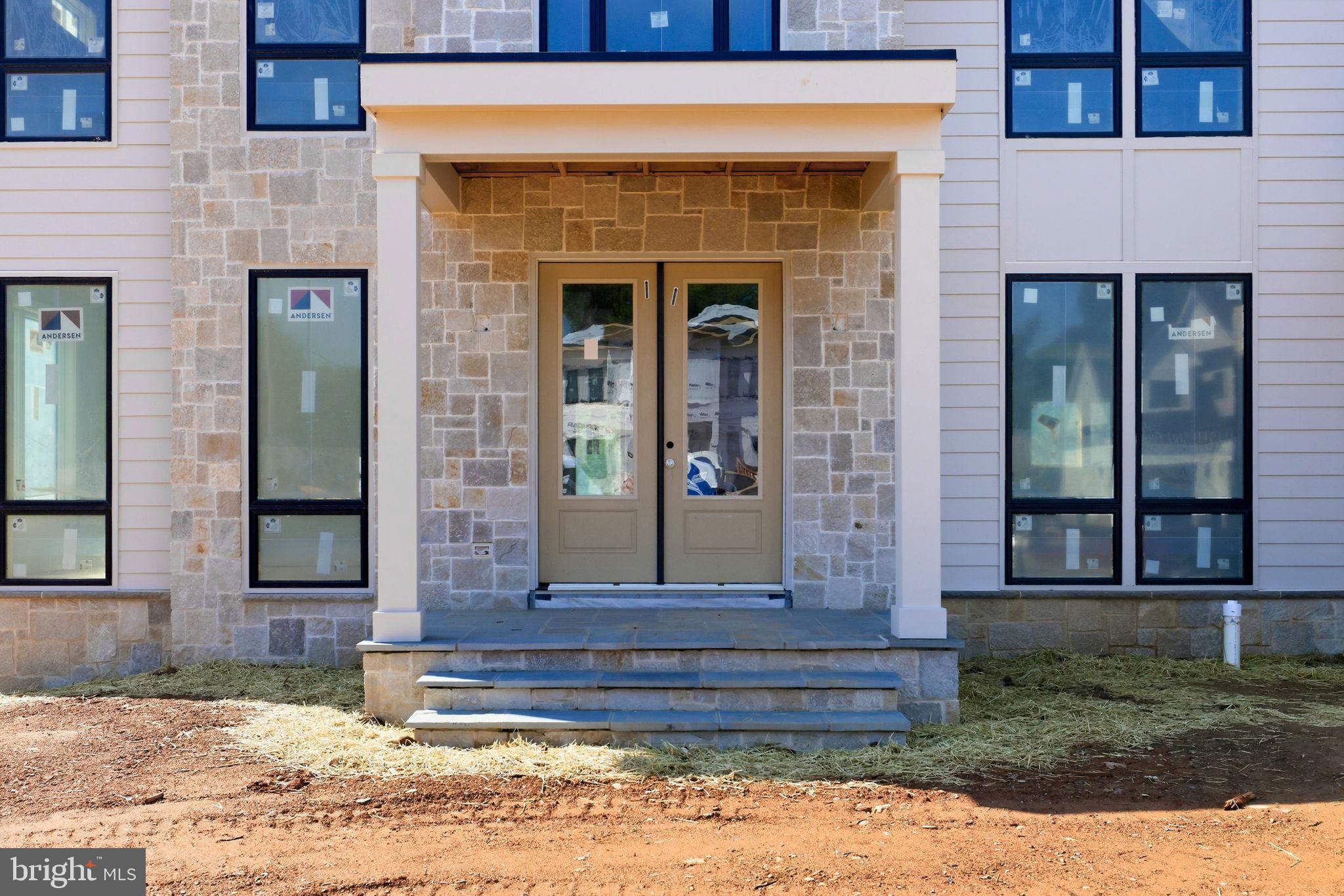 10801 Mason Hunt Court Reston, VA 20190 - Photo 5 of 26 a front view of a house with garden