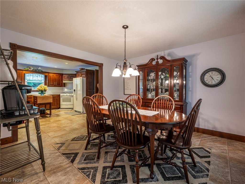 9452 Pleasant Hill Road Northwest Dundee, OH 44624 - Photo 8 of 35 View of tiled dining area