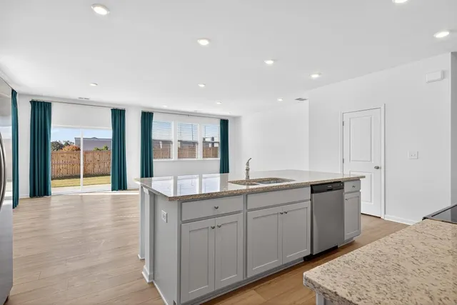 a large bathroom with double vanity and a mirror