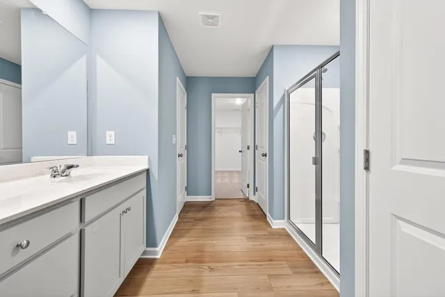 a view of a bathroom with a sink and mirror