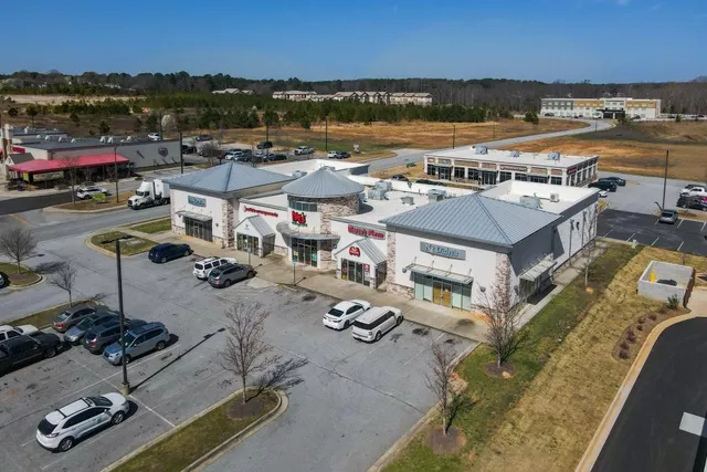 an aerial view of a house with lake view