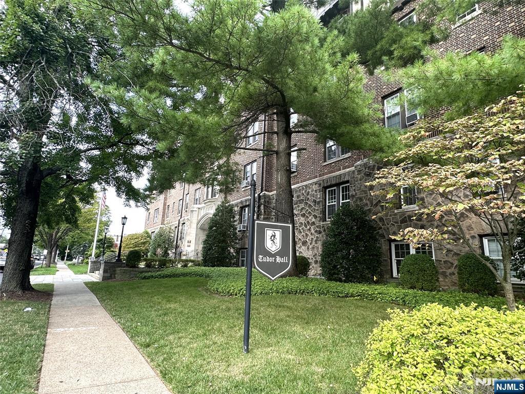 275 Engle Street, Unit J4 Englewood, NJ 07631 - Photo 2 of 12 a sign board with yard in front of it