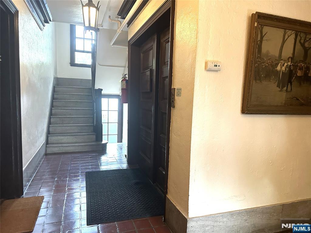 275 Engle Street, Unit J4 Englewood, NJ 07631 - Photo 5 of 12 a view of entryway and hall with wooden floor