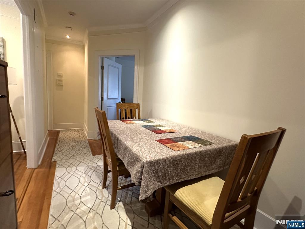 275 Engle Street, Unit J4 Englewood, NJ 07631 - Photo 7 of 12 a view of a dining room with furniture and a potted plant