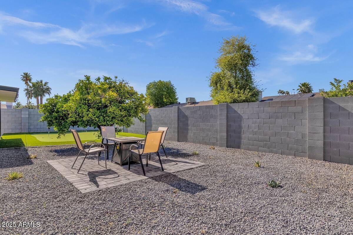2452 East Manhatton Drive Tempe, AZ 85282 - Photo 12 of 25 a swimming pool with outdoor seating and yard