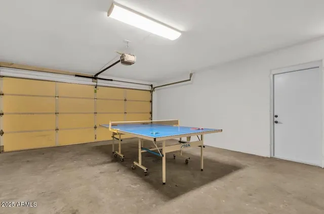 a room with a table and chairs