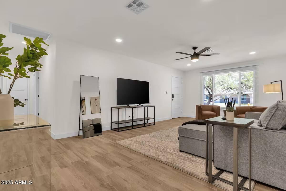2452 East Manhatton Drive Tempe, AZ 85282 - Photo 20 of 25 a living room with furniture and a flat screen tv