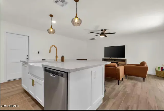 a view of living room with furniture and flat screen tv