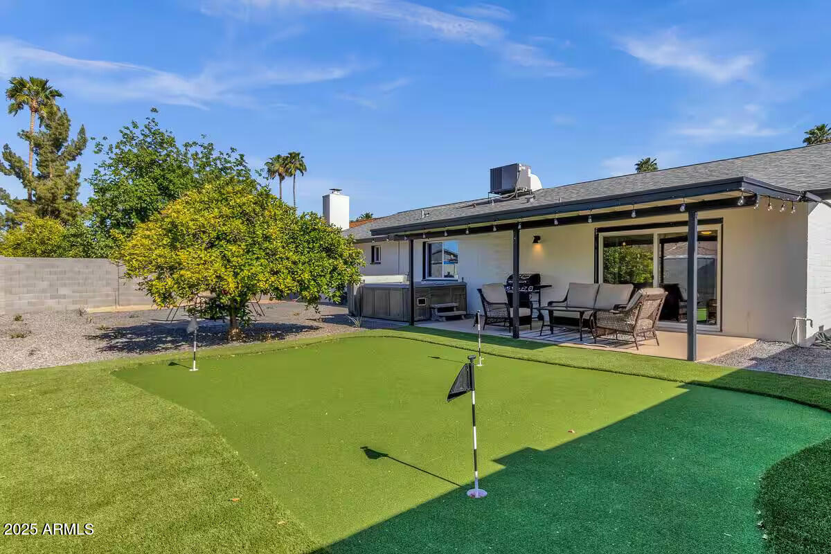 2452 East Manhatton Drive Tempe, AZ 85282 - Photo 23 of 25 a view of a swimming pool with chairs