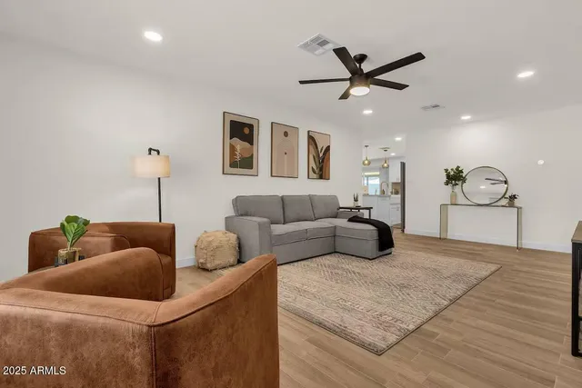 a bedroom with a bed and ceiling fan