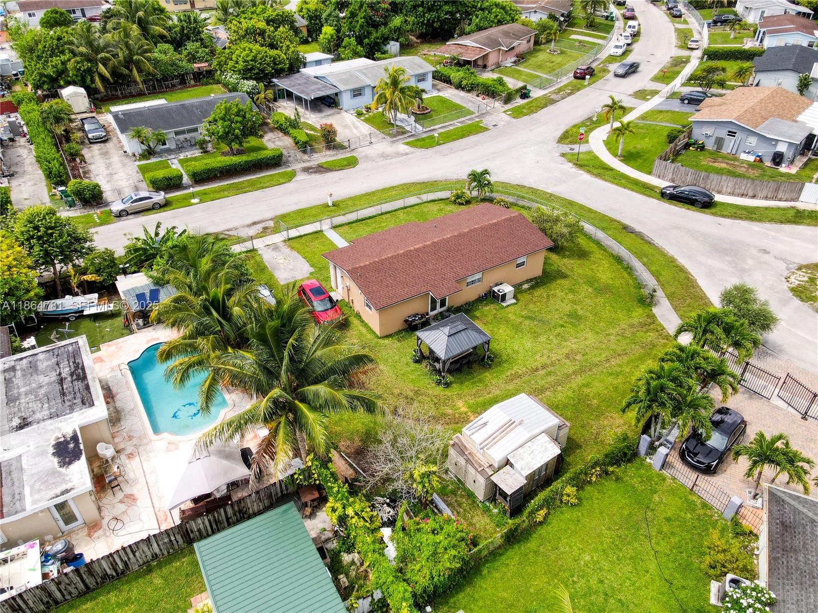 30211 Southwest 158th Road Homestead, FL 33033 - Photo 16 of 47 an aerial view of a house with a swimming pool yard and outdoor seating