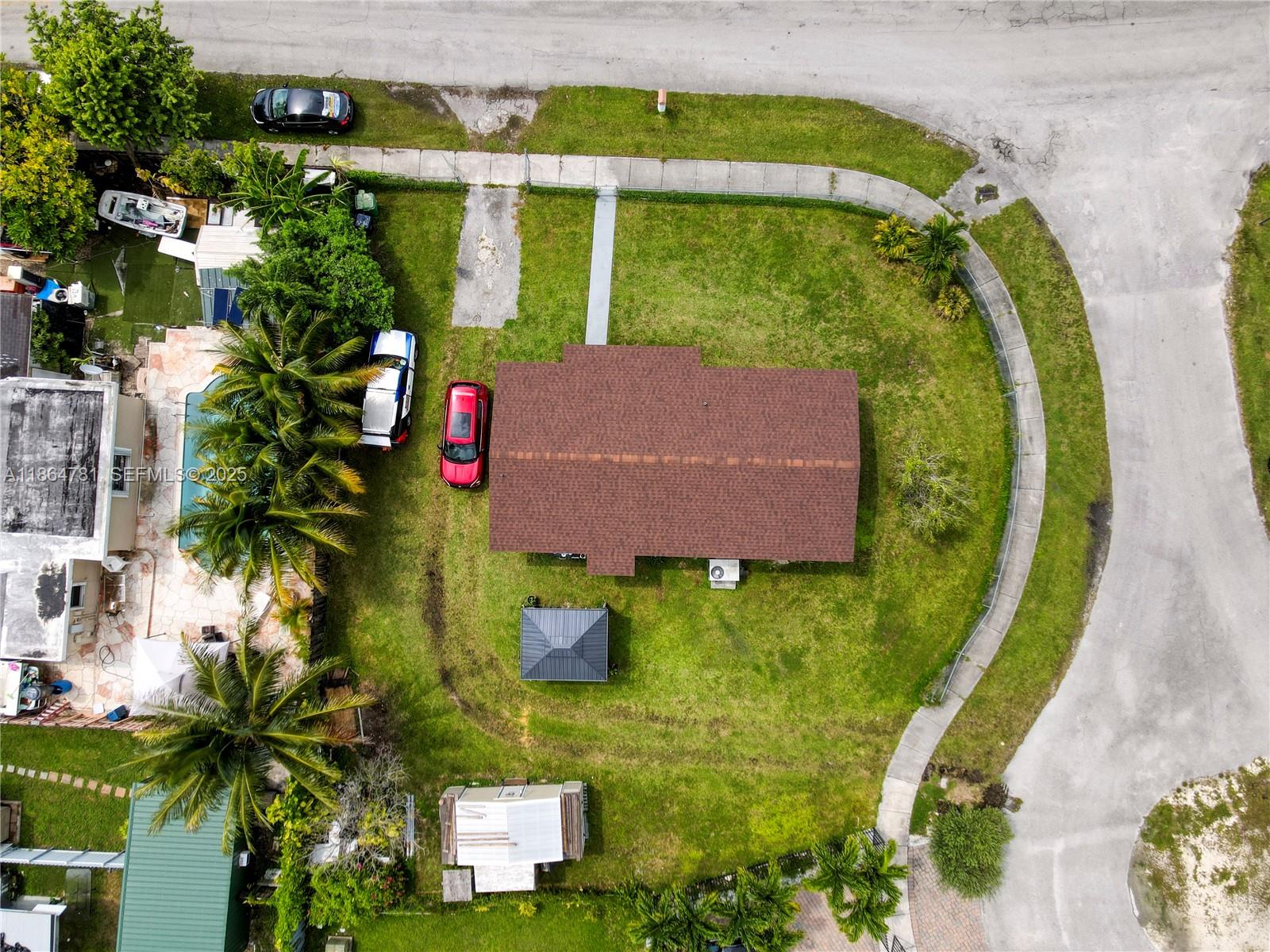 30211 Southwest 158th Road Homestead, FL 33033 - Photo 21 of 47 an aerial view of a house with a garden