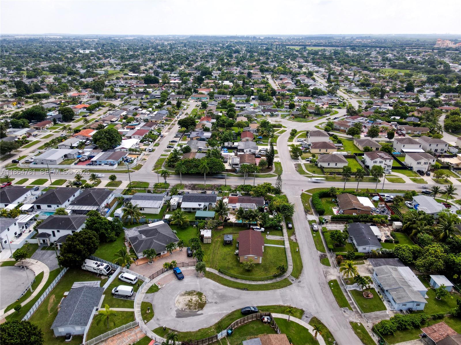 30211 Southwest 158th Road Homestead, FL 33033 - Photo 24 of 47 an aerial view of residential houses with outdoor space