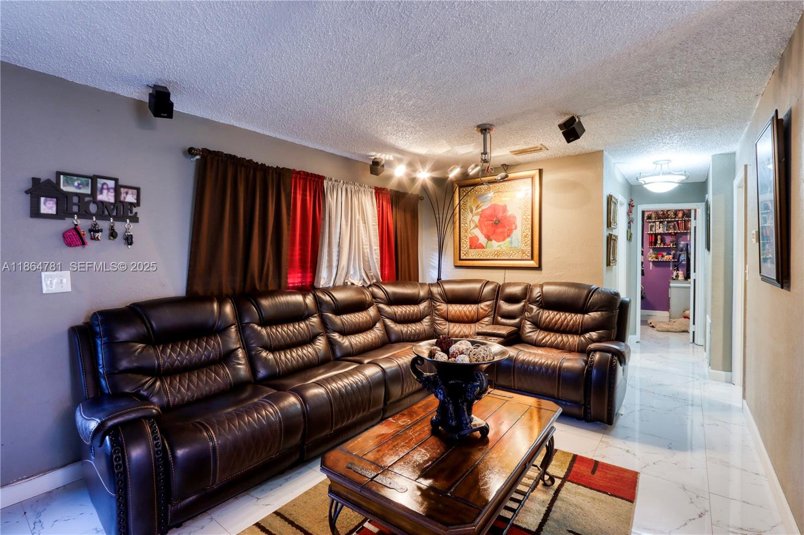 30211 Southwest 158th Road Homestead, FL 33033 - Photo 26 of 47 a media room with lots of chairs and a rug