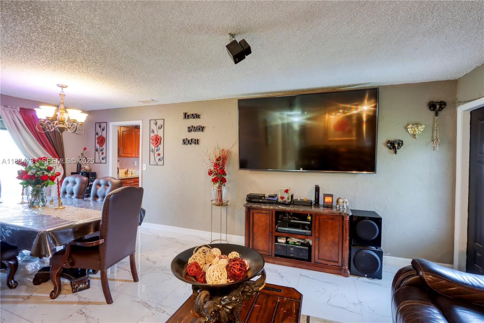 30211 Southwest 158th Road Homestead, FL 33033 - Photo 28 of 47 a living room with furniture and a flat screen tv