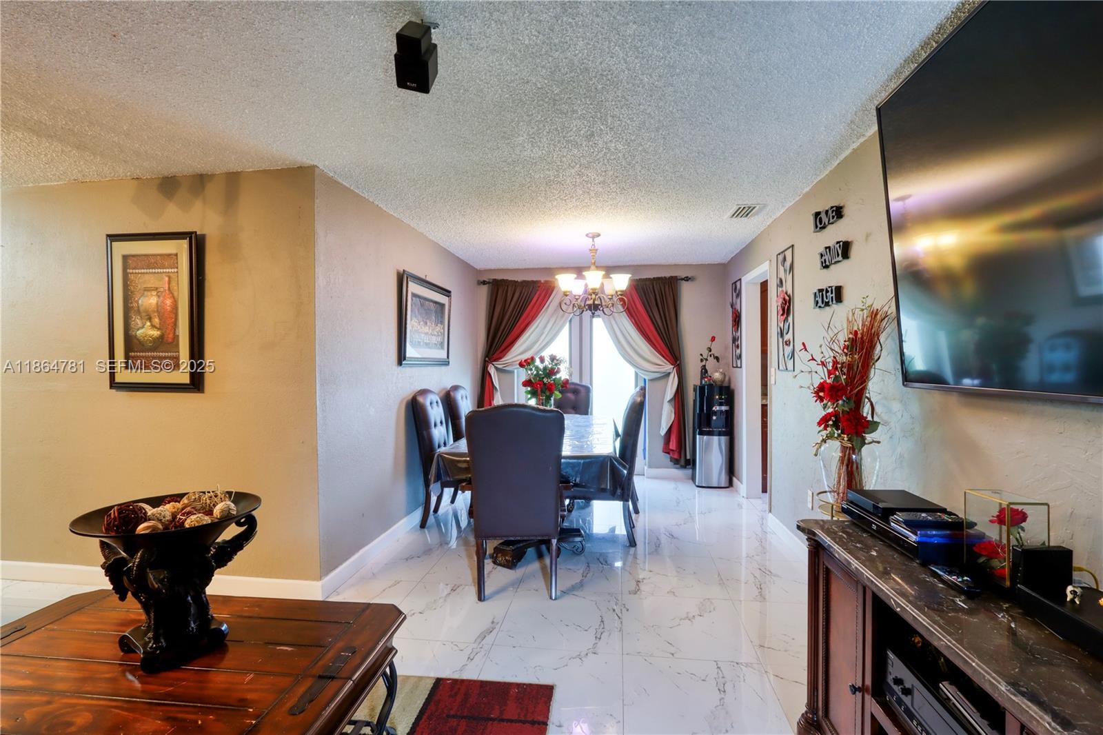 30211 Southwest 158th Road Homestead, FL 33033 - Photo 29 of 47 a living room with furniture and a wooden floor