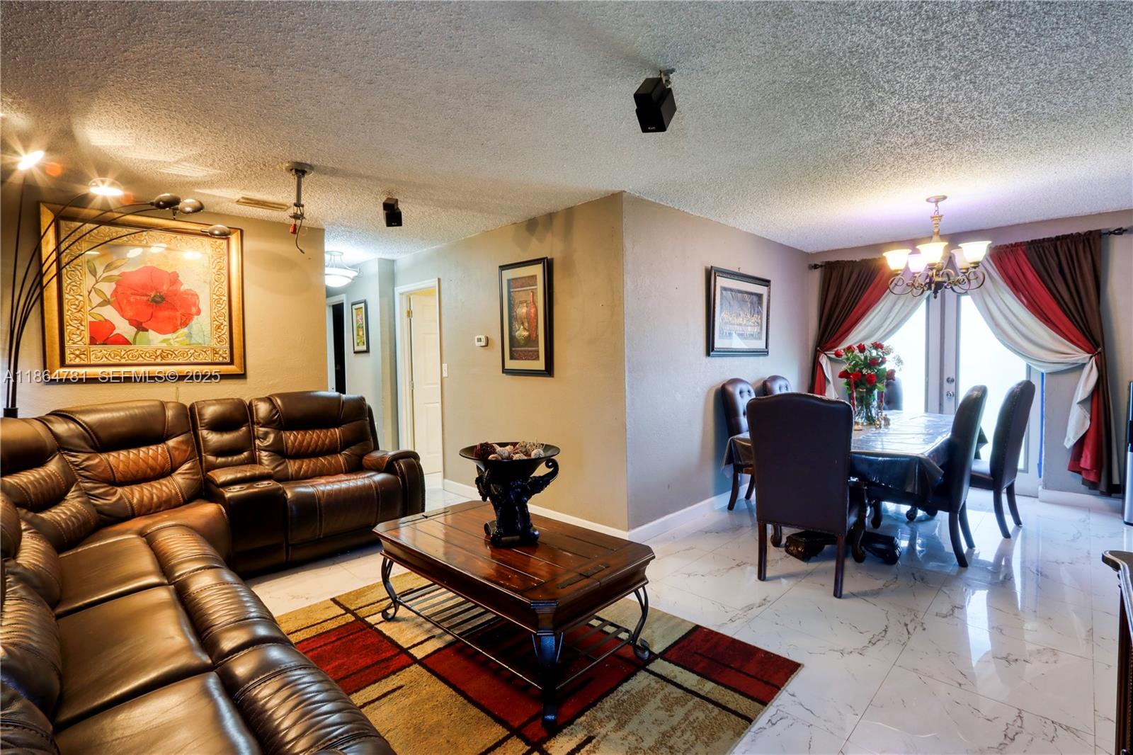 30211 Southwest 158th Road Homestead, FL 33033 - Photo 30 of 47 a living room with furniture a rug and a window