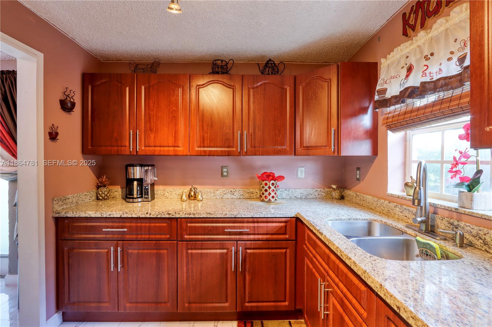 30211 Southwest 158th Road Homestead, FL 33033 - Photo 35 of 47 a kitchen with stainless steel appliances granite countertop a sink dishwasher stove and cabinets with wooden floor