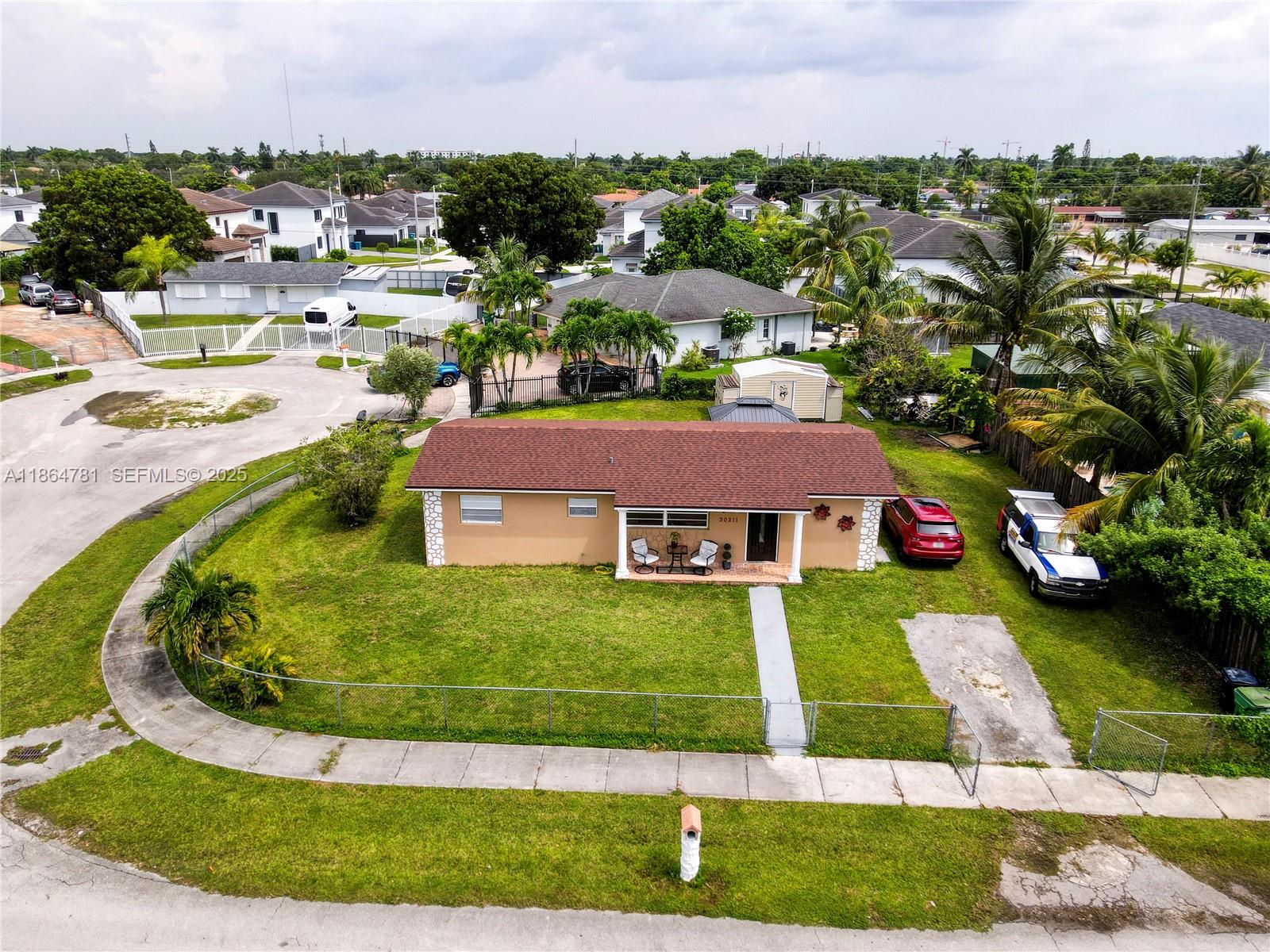 30211 Southwest 158th Road Homestead, FL 33033 - Photo 4 of 47 a aerial view of a house with a yard