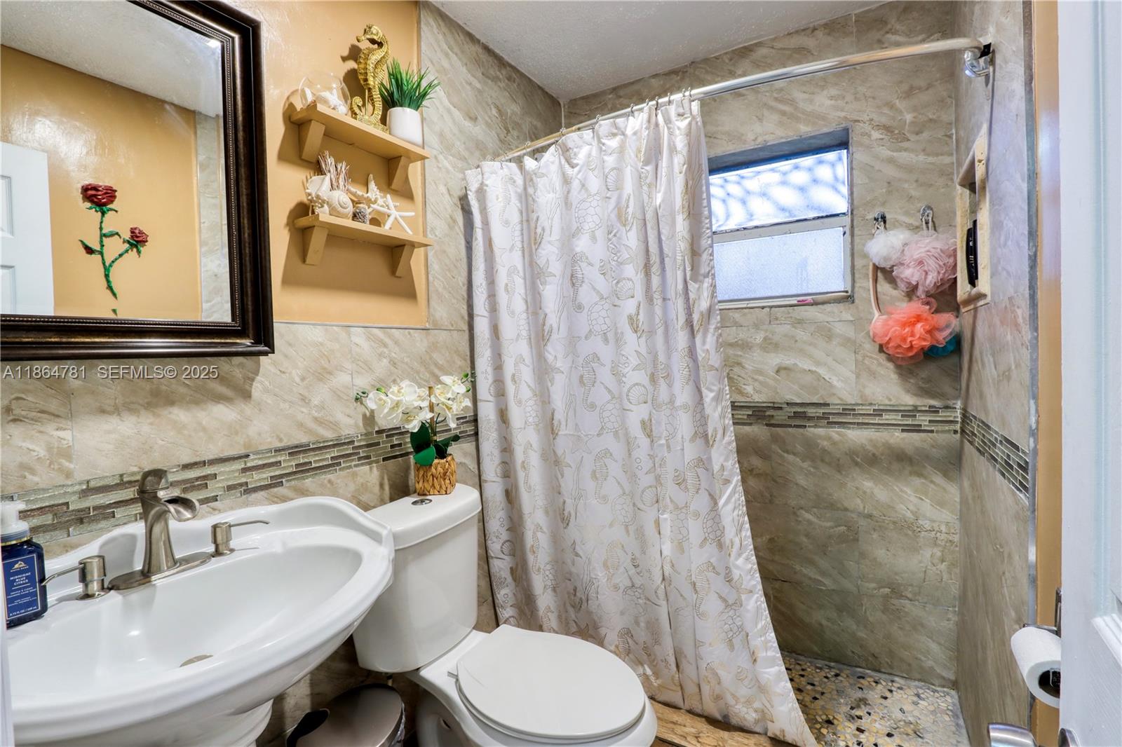 30211 Southwest 158th Road Homestead, FL 33033 - Photo 41 of 47 a bathroom with a sink toilet and shower