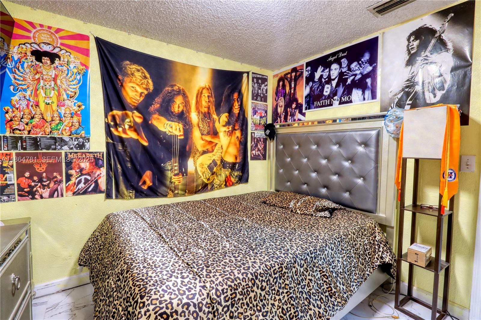 30211 Southwest 158th Road Homestead, FL 33033 - Photo 44 of 47 a bedroom with a bed and a painting on the wall