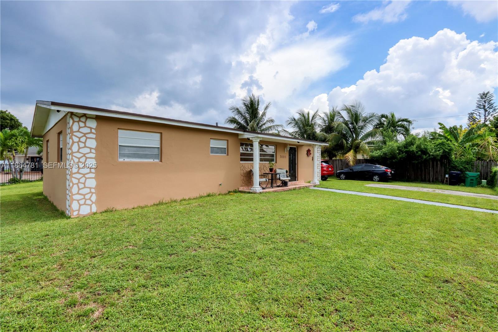 30211 Southwest 158th Road Homestead, FL 33033 - Photo 5 of 47 front view of house with a yard