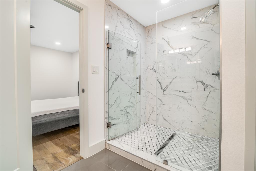 8722 Angora Street Dallas, TX 75218 - Photo 18 of 26 a bathroom with a shower